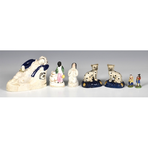 68 - A group of five Staffordshire figures, of a Sleeping Boy with a hat and wearing a blue jacket, white... 