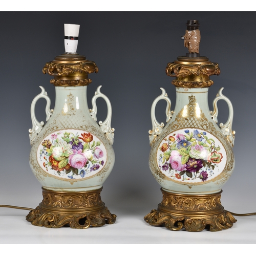 73 - A pair of 19th century porcelain vase lamps, probably French, the stout, baluster vases in a celadon... 