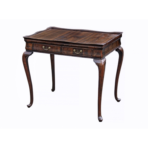 760 - An unusual George II silver table, in an exotic veneer with dark striping, the tray top with serpent... 