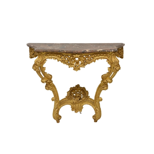 762 - A Louis XV style carved giltwood console table, the mottled red, grey and white marble top with serp... 