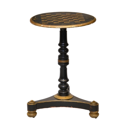 767 - A late-Regency ebonised, parcel gilt and penwork games table, the circular gaming top with delicate ... 