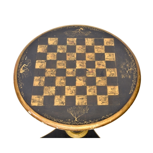 767 - A late-Regency ebonised, parcel gilt and penwork games table, the circular gaming top with delicate ... 