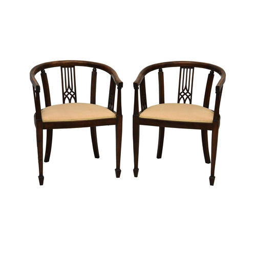 779 - A pair of Edwardian strung mahogany tub chairs, the top rail with boxwood stringing over a pierced s... 