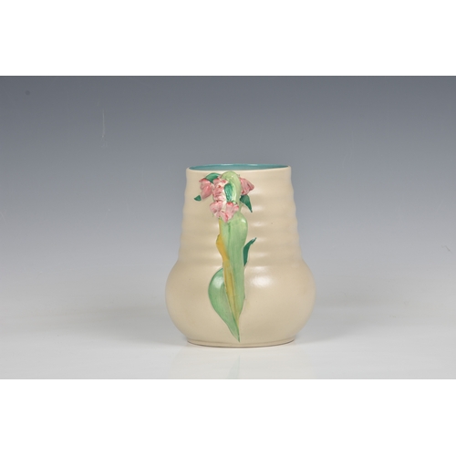 78 - A Clarice Cliff jug, c.1936, moulded floral, leaf and stem handle, ribbed body, printed Newport Pott... 