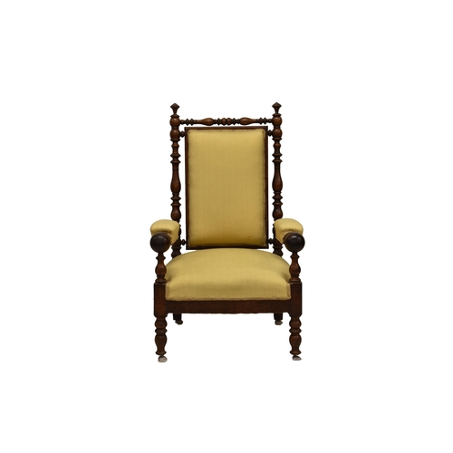 786 - A Victorian turned walnut arm chair, the turned top rail and uprights with finial flanking a padded ... 