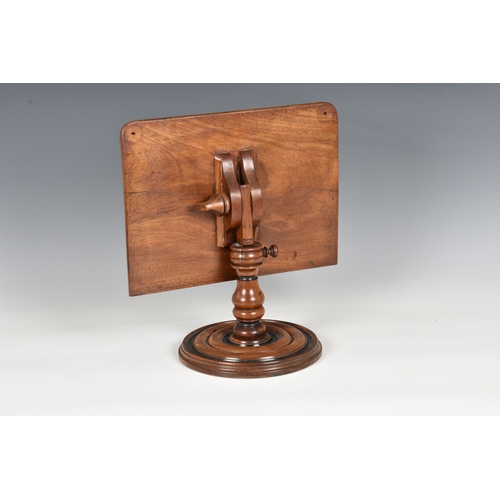 797 - A Victorian walnut adjustable table top book stand, the rectangular stand with brass page stays (one... 