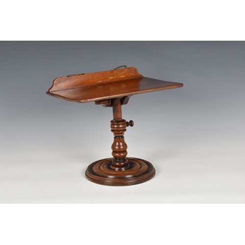 797 - A Victorian walnut adjustable table top book stand, the rectangular stand with brass page stays (one... 