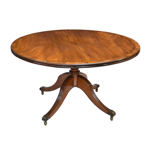 800 - A 19th century mahogany tilt-top breakfast table, the circular top with reeded edge and rosewood cro... 