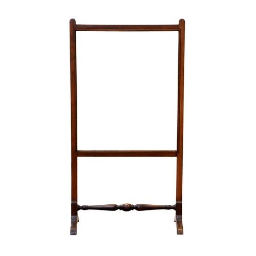 808 - A Victorian mahogany glazed firescreen, the rectangular glazed screen on trestle supports united by ... 