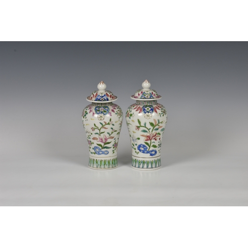 86 - A closely matched pair of 19th century famille rose porcelain covered vases by Samson of Paris, balu... 