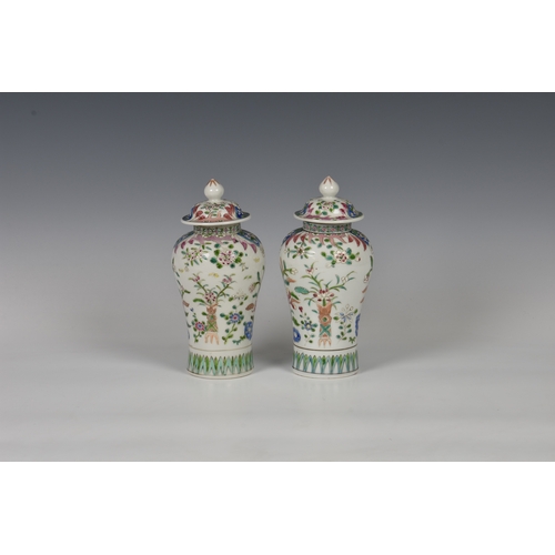 86 - A closely matched pair of 19th century famille rose porcelain covered vases by Samson of Paris, balu... 