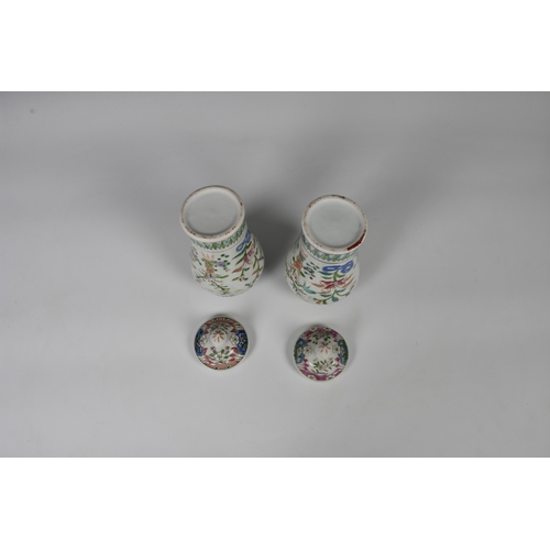 86 - A closely matched pair of 19th century famille rose porcelain covered vases by Samson of Paris, balu... 