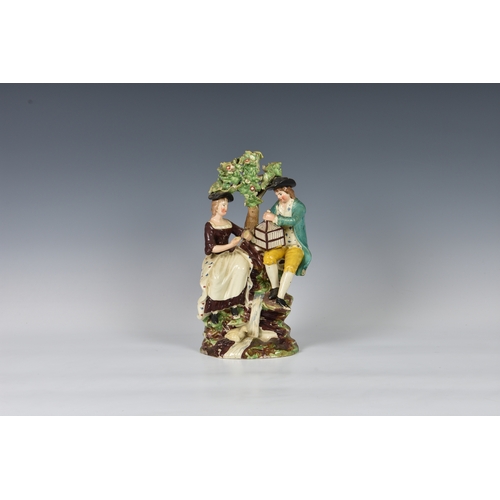 9 - A large Staffordshire Walton style Pearlware pottery figure group, second quarter 19th century, depi... 