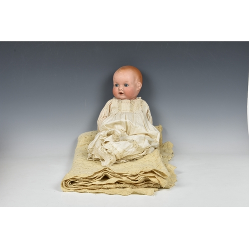 121 - An Armand Marseille bisque head baby doll impressed '518 / 61/2 K', with painted moulded hair, closi... 