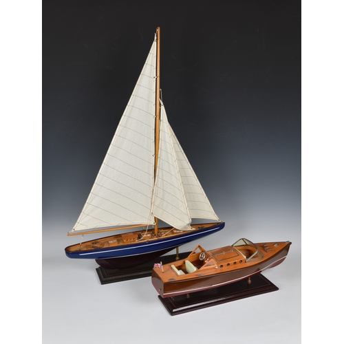 127 - Two wooden model boats late 20th century, comprising a mid-century style speedboat, 19½in. (49.5cm.)... 