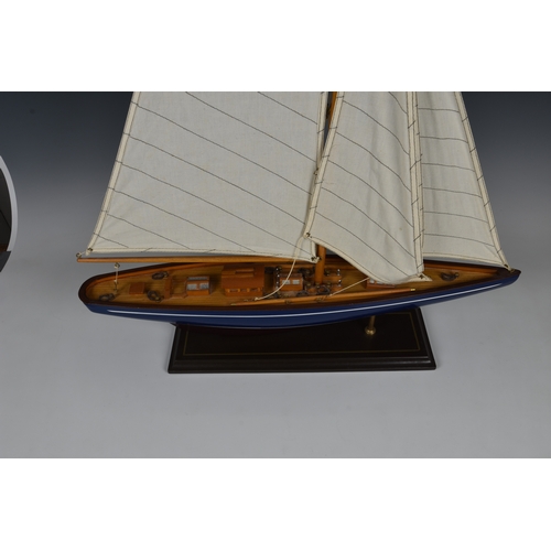 127 - Two wooden model boats late 20th century, comprising a mid-century style speedboat, 19½in. (49.5cm.)... 