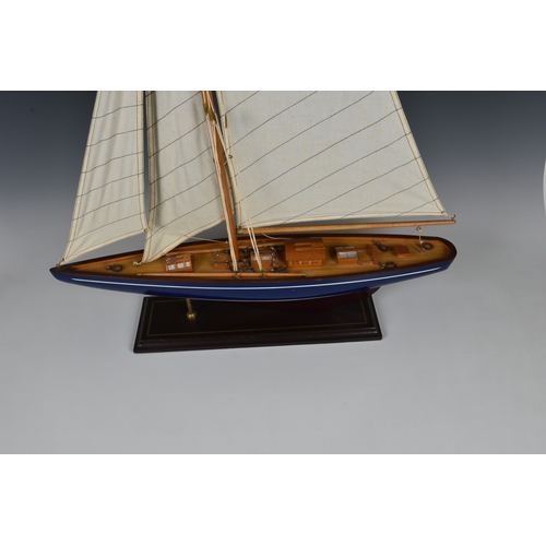 127 - Two wooden model boats late 20th century, comprising a mid-century style speedboat, 19½in. (49.5cm.)... 