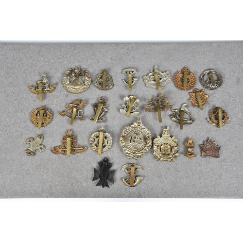 19 - Military interest - A collection of cap badges to include Irish Rifles; The King's Own (Lancaster); ... 