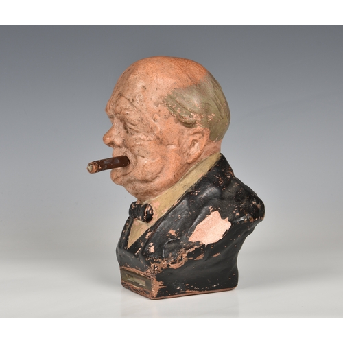 24 - A mid 20th Century terracotta striker / table lighter in the form of Winston Churchill with his ciga... 