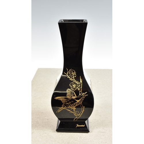 930 - A Baccarat black glass baluster shaped square section vaseJaponesque style, decorated in gold depict... 