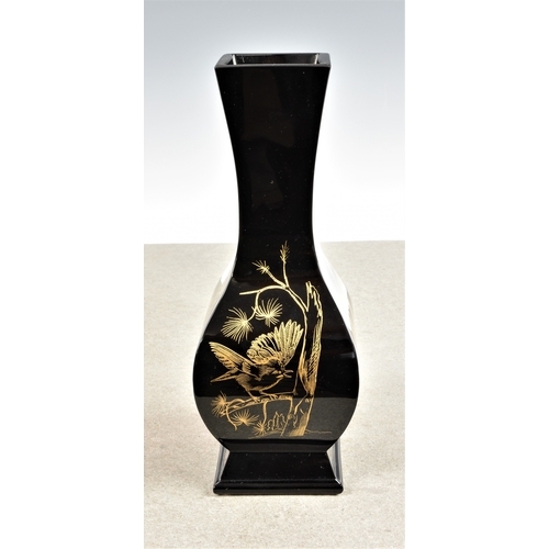 930 - A Baccarat black glass baluster shaped square section vaseJaponesque style, decorated in gold depict... 