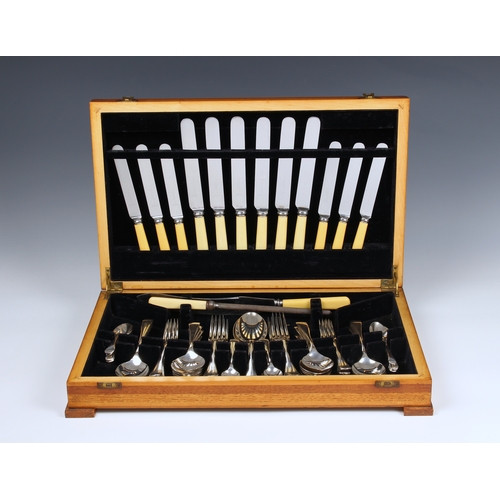 1206 - A mid-century walnut cased canteen of silver plated flatware Old English pattern, six place settings... 