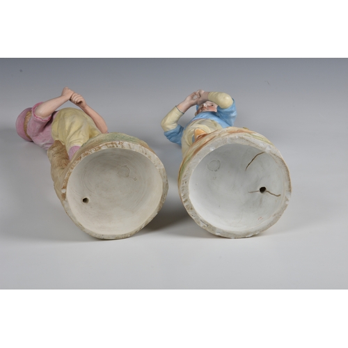 15 - A rare pair of German Heubach biscuit porcelain figures of baseball players  c.1890, the batter wear... 