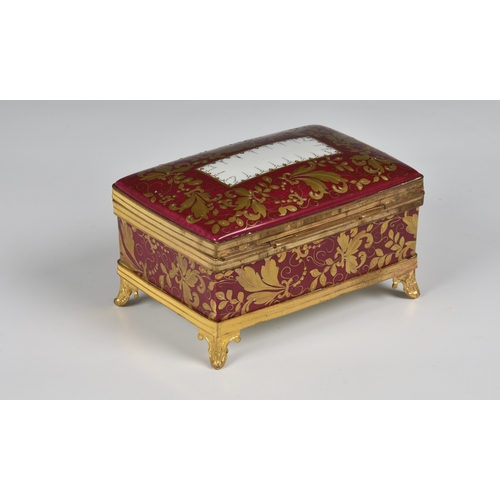 27 - A Limoges porcelain casket with domed lid and gilt metal mounts  hand painted and gilded decoration ... 
