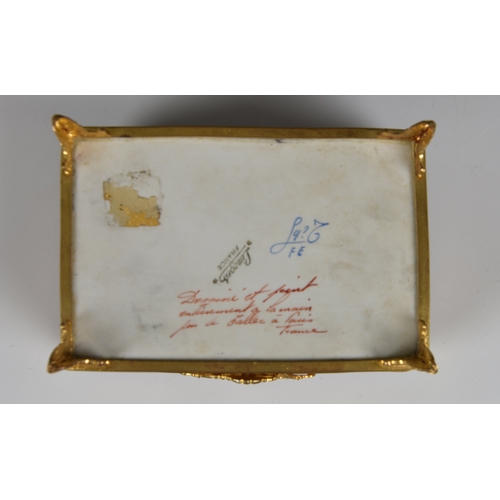 27 - A Limoges porcelain casket with domed lid and gilt metal mounts  hand painted and gilded decoration ... 