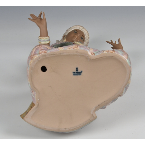 8 - Lladro Pottery figure of an Indonesian dancing girl  modelled kneeling wearing traditional dress, fa... 