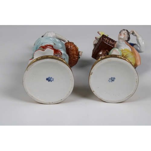 32 - A pair of Wessel, Frankenthal porcelain figures,  of a woman holding a rose and a man with a bird in... 