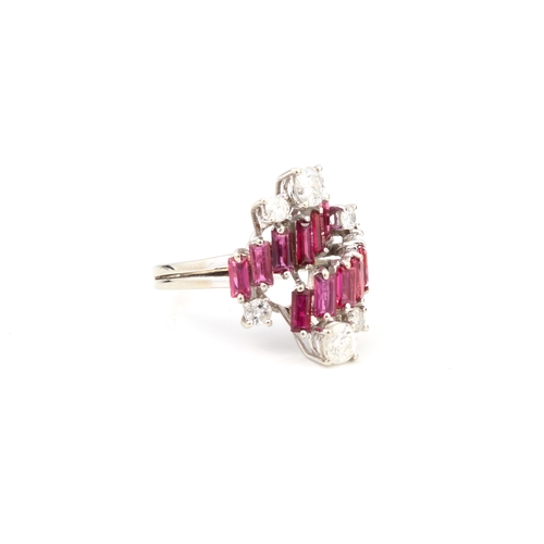 100 - A vintage 18ct white gold, ruby and diamond modernist style ring hallmarked '18CT', with two stepped... 