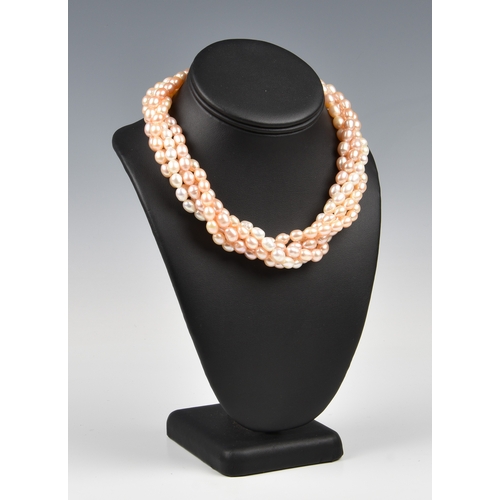 104 - A five strand freshwater pearl necklace the pink toned, oval pearls with diamond set hook and eye cl... 