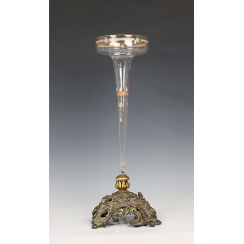 1117 - A late 19th Century bronze and clear glass centrepiece the heavy pierced base, having floral, foliat... 