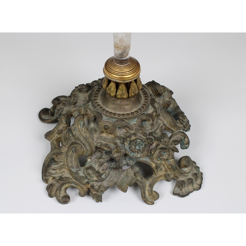 1117 - A late 19th Century bronze and clear glass centrepiece the heavy pierced base, having floral, foliat... 