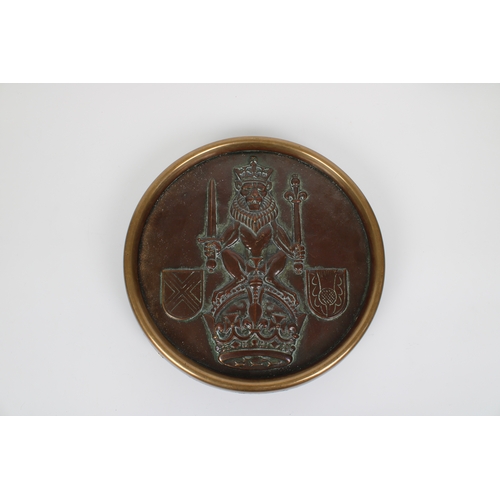 1118 - A circular bronze plaque depicting the Royal coat of arms (Scotland), 11½in. (29.2cm.) diameter, fix... 