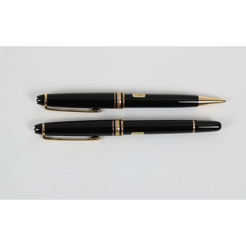 1121 - A cased Mont Blanc fountain pen and pencil set with leather pocket pouch.