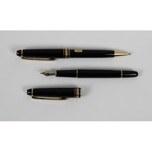 1121 - A cased Mont Blanc fountain pen and pencil set with leather pocket pouch.