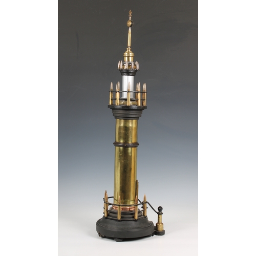 1124 - A large trench art lighthouse made with shells and bullets, the centre with turning cog and mechanis... 