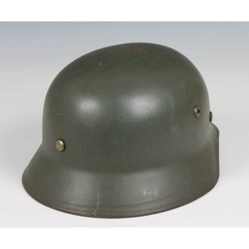 1125 - WW2 German Helmet with unusual OT emblem (Organisation Todt) liner and stamped ET58 and 4564.