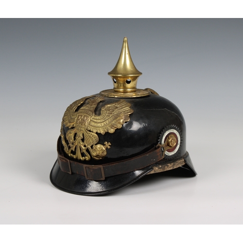 1127 - A World War I Imperial German Prussian Infantry pickelhaube mounted with brass eagle helmet plate.