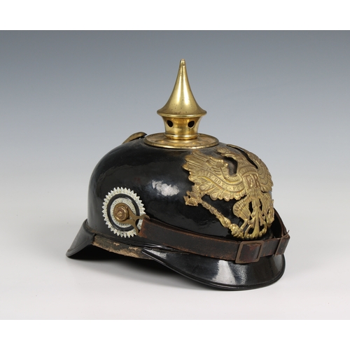 1127 - A World War I Imperial German Prussian Infantry pickelhaube mounted with brass eagle helmet plate.