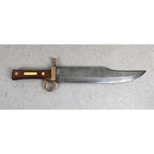 1131 - A heavy Civil War period Bowie Knife of large proportions with 11½in. steel blade, to later brass cr... 