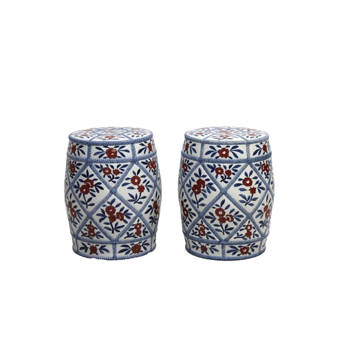 1178 - A pair of Chinese ceramic barrel shaped garden seats 20th century or later, each decorated with a bl... 