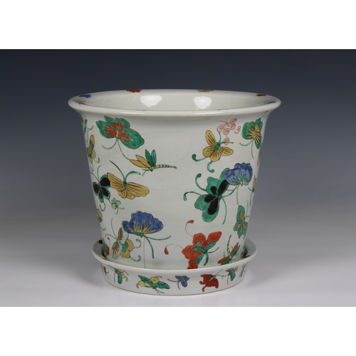 1180 - A 20th century Chinese porcelain jardiniere and saucer base decorated with polychrome butterflies, 1... 