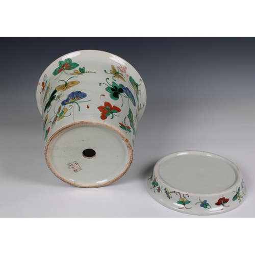 1180 - A 20th century Chinese porcelain jardiniere and saucer base decorated with polychrome butterflies, 1... 