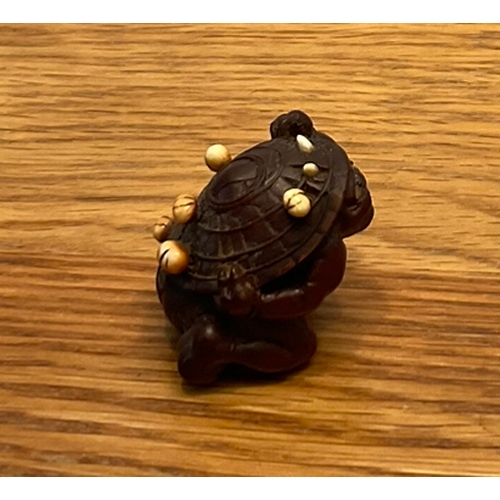 1222 - A WOOD NETSUKE OF A COWERING ONI Unsigned, Japan, Nagoya, 19th century, Edo period (1615-1868) The o... 