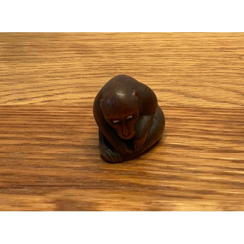 1224 - A WOOD NETSUKE OF A MONKEY PICKING FLEAS Signed Koichi, japan, second half of 19th century Finely ca... 