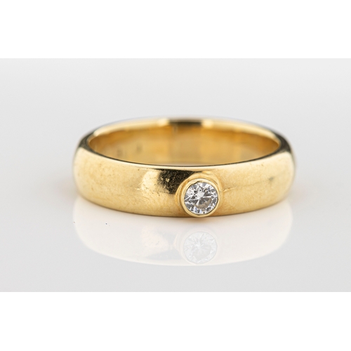 163 - An 18ct yellow gold and diamond solitaire ring the round brilliant cut diamond approx 0.10ct, rub-ov... 