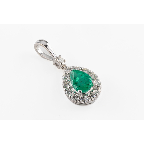 201 - An 18ct white gold emerald and diamond pendant the pear cut emerald approx 0.86ct, surrounded by rou... 